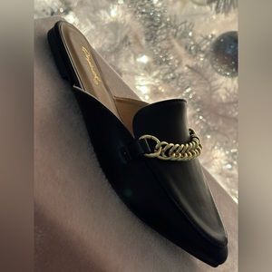 Black flats with gold buckle